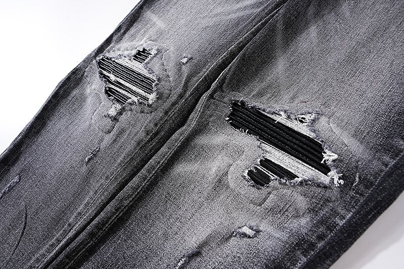 AMIRI Washed Black Distressed Jeans — detail