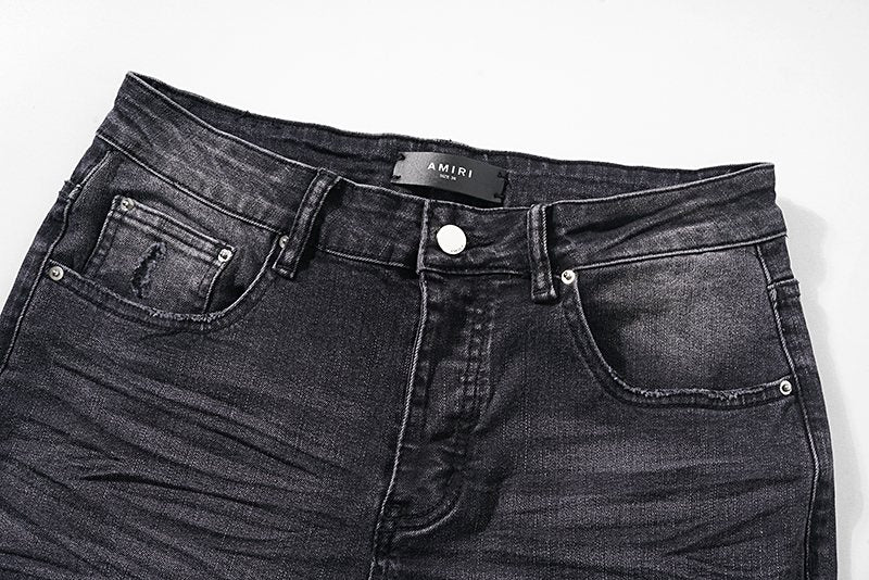 AMIRI Distressed Washed Black Graphic Jeans — detail